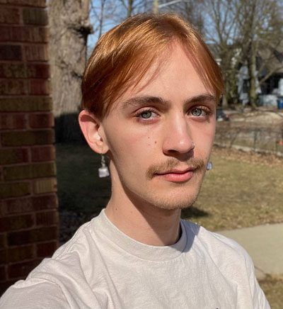 A young white man with short light brown hair.