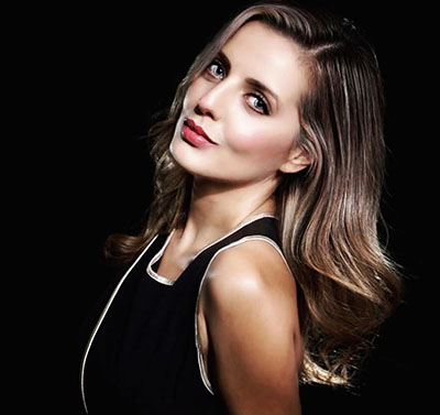 Mexican woman with black dress and long light brown hair